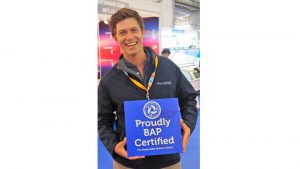 Man holding BAP Certificate
