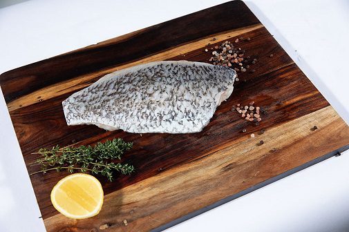 Barramundi on chopping board